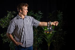 Gripper drone hanging onto researcher Anton Bredenbeck