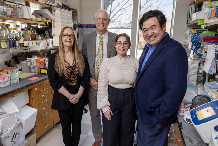 Study co-authors from Duke University stand in the lab together.