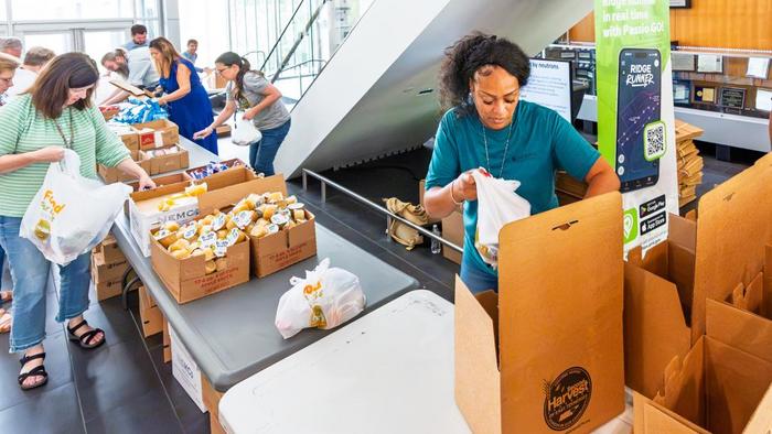 Employees volunteered to pack food bags for kids