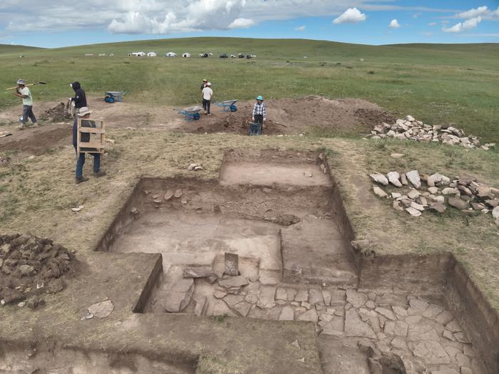 Excavation of the stone platform with the chimney