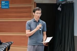 Session chair Prof. Dr. Weiqi Zhou moderating plenary talks