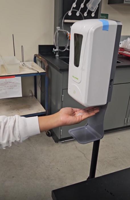 Hand sanitizer dispenser