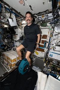 NASA astronaut Jack Hathaway pedaling on the exercise cycle inside the International Space Station’s Destiny laboratory module. Credit: NASA/Jessica Meir