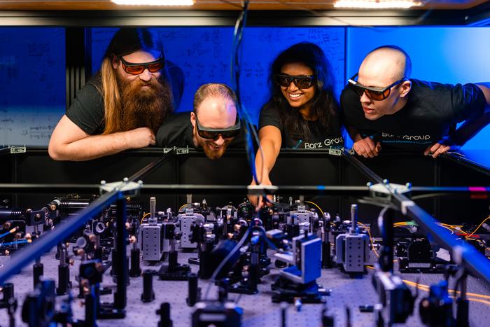 Nico Hauser (left) with other researchers from the Barz group.