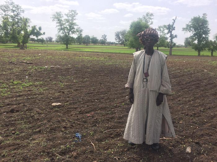 Farmer shows improved soil on his farmland