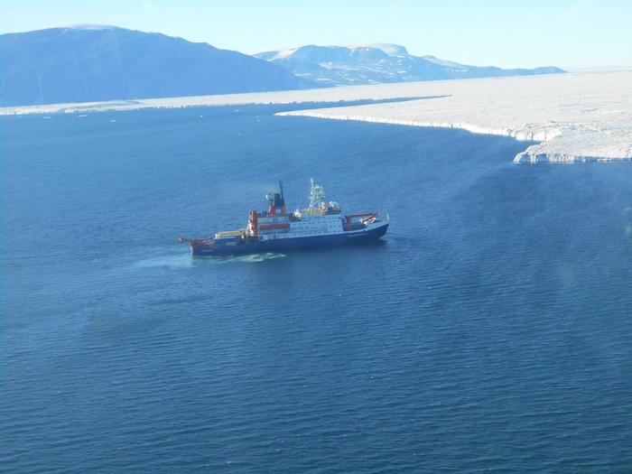 The RV Polarstern, taken from a helicopter as the ship was sailing in front of the Nioghalvfjerdsfjorden Glacier