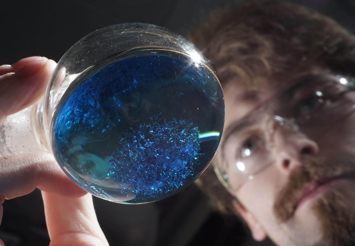 Laboratory Vessel Containing Crystals of a Novel Molecule