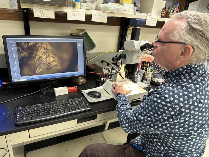 Von Konrat at microscope