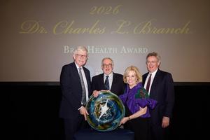 Dr. Collins and others at the event