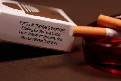 Pack of Cigarettes with Ashtray and Lit Cigarettes