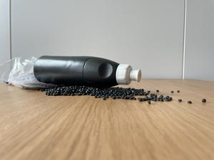 Plastic pellets and bottle of PE