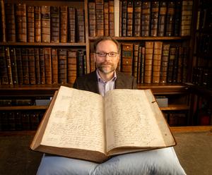 Dr Michael Edwards with Pepys letter book