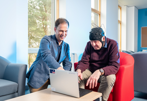 Dr George Stothart with a volunteer demonstrating Fastball EEG