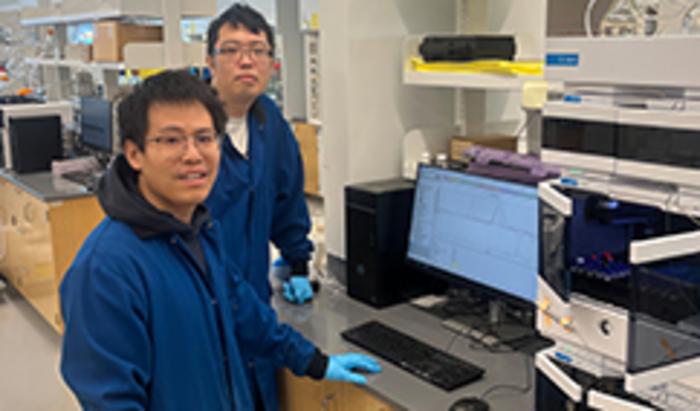 Rutgers chemist Yuwei Gu and student