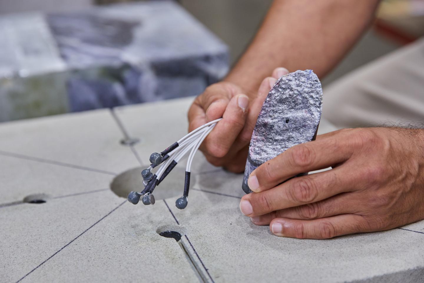 Ghassemi Holds a Core Sample