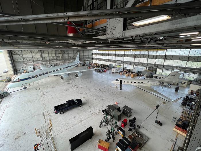 NASA aircraft arrive at the hangar.