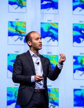 Researcher with Data Visualization in the Background