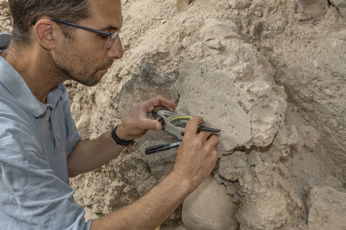 Yoav Vaknin measuring at the site.