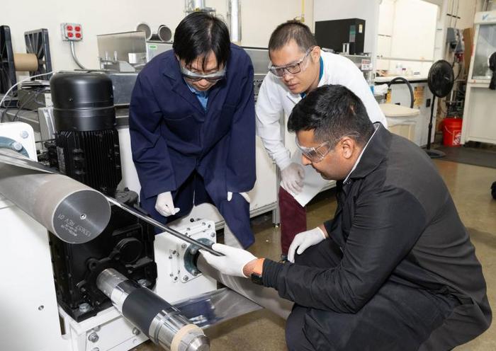 ORNL scientist Zhijia Du, white coat; former ORNL scientist Jianlin Li, blue coat; and Ateios CEO Rajan Kumar