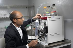 Karthik Sankaranarayanan operates protein isolation equipment