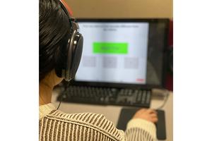 Participant listens to a hearing test