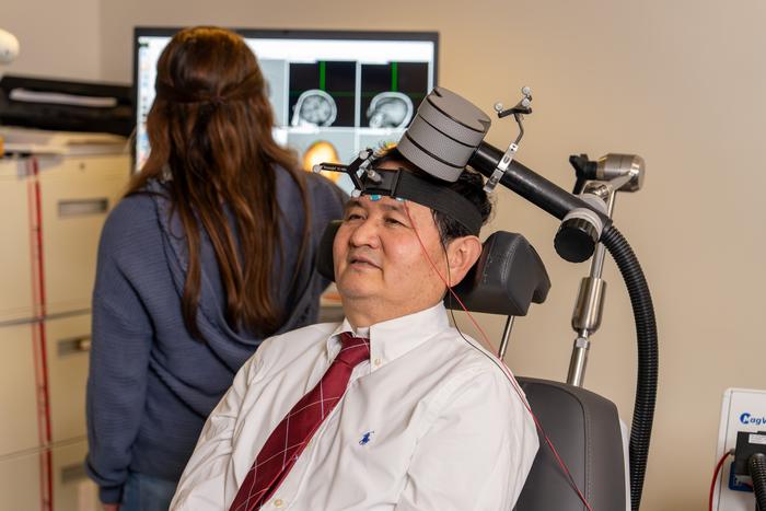 Xingbao Li, M.D., receives rTMS