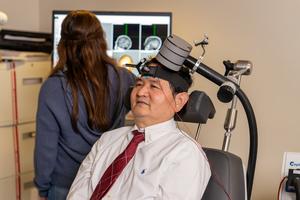 Xingbao Li, M.D., receives rTMS
