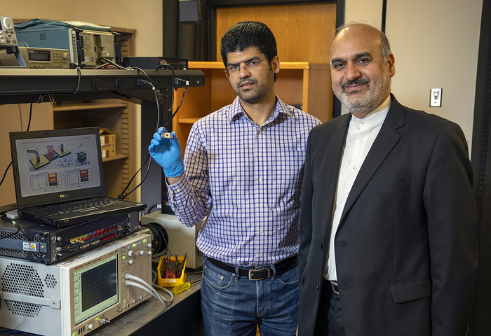 Ali and Sajjad with packaged device.jpg