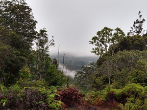 View from a ridge over cloudy slopes of Mt. Pompangeo