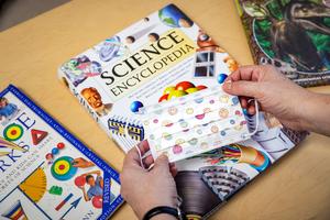 School books and a child's mask