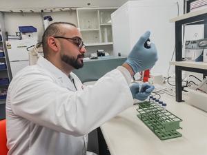 PhD candidate Joseph Doctor in the lab