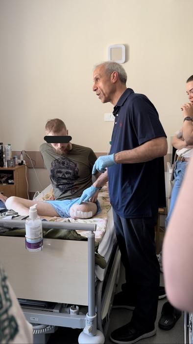 Dr. Steve P. Cohen examining an amputee in Ukraine in 2024