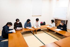 Nomura instructs her students in a counseling room with tatami mats