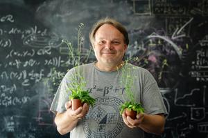 ISTA professor Jiří Friml with two arapidopsis plants