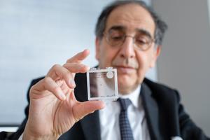 José-Alain Sahel, M.D., holding the PRIMA implant