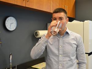 researcher drinking tap water