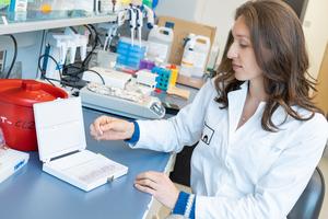 Dr. Carolina Tropini working in a lab