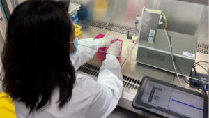 Rubaiya Hussain with the device in the Biology Lab