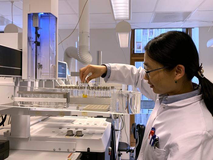 Feiyan Liang preparing samples