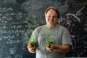 ISTA professor Jiří Friml with two arapidopsis plants