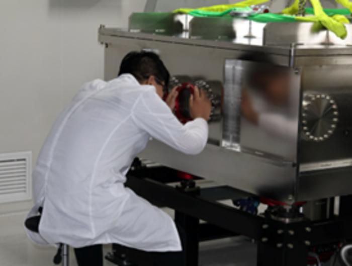 The students are checking the optical chamber