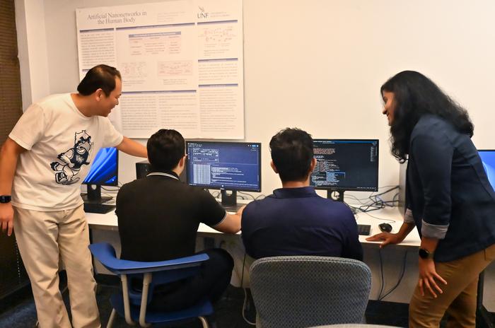 UNF faculty and students working on code processing