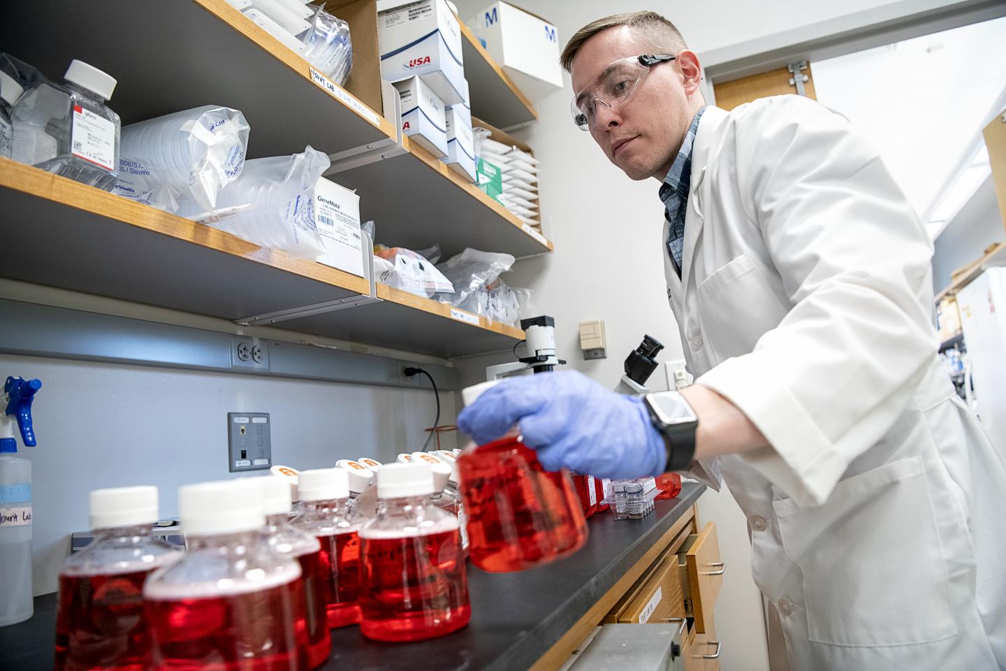 Researcher with Test Kits