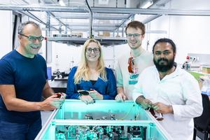 Research team with spectrometer