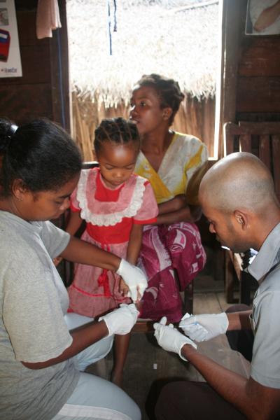 Researchers Measuring Hemoglobin Levels in Children