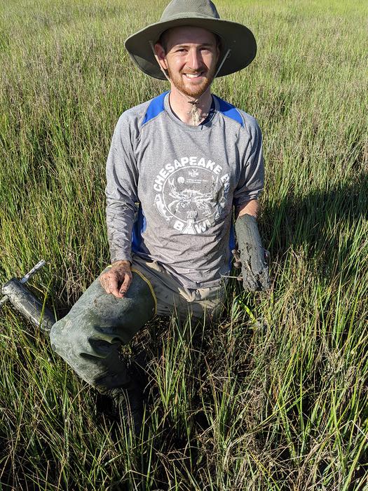 Kyle Runion holding soil core