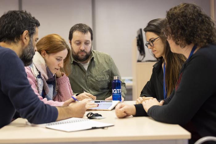 The GCAT team engaged in a team meeting