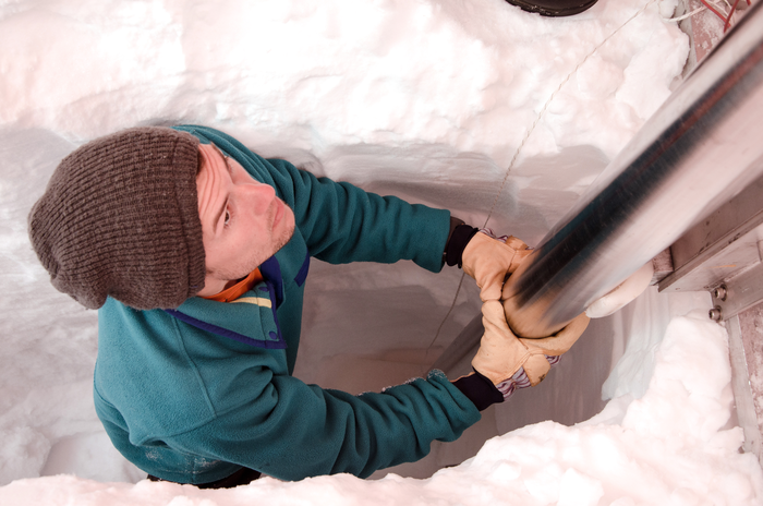 Matthew Osman drilling ice cores