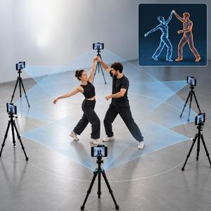 A dancing couple surrounded by smartphone cameras