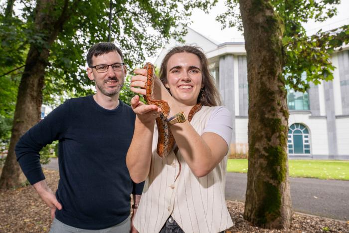 Dr Kevin Healy and Amy Duclaux from the School of Natural Sciences, University of Galway, with a corn snake. Credit Andrew Downes, Xposure.